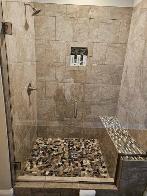 Primary bath walk-in glass shower with bench